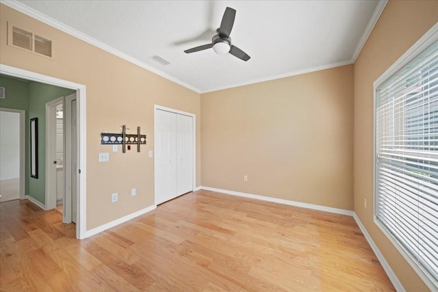 4254 Berwick Dr, Lake Wales, FL 33859 - unfurnished bedroom with crown molding, light wood-style floors, a closet, and a ceiling fan