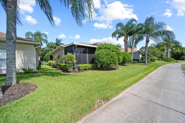 4254 Berwick Dr, Lake Wales, FL 33859 - view of grassy yard with a sunroom
