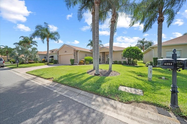 4254 Berwick Dr, Lake Wales, FL 33859 - view of front of property featuring driveway, a garage, stucco siding, and a front yard