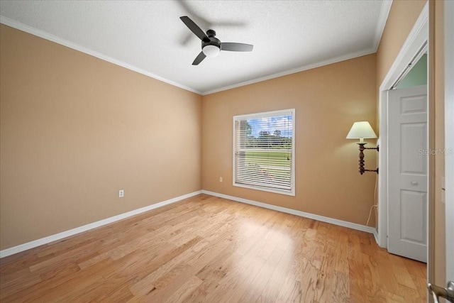 4254 Berwick Dr, Lake Wales, FL 33859 - spare room featuring light wood-style floors, a ceiling fan, and crown molding