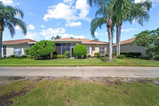 4254 Berwick Dr, Lake Wales, FL 33859 - ranch-style house with stucco siding and a front lawn
