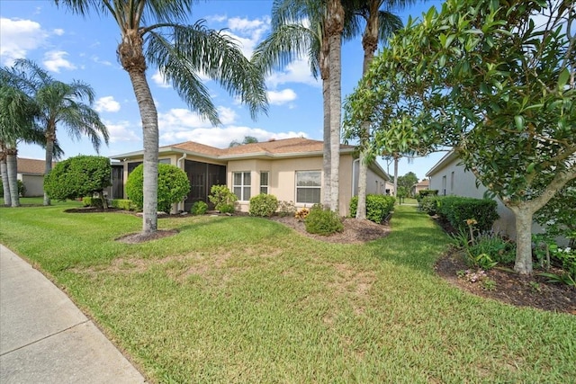 4254 Berwick Dr, Lake Wales, FL 33859 - view of front facade with stucco siding and a front lawn