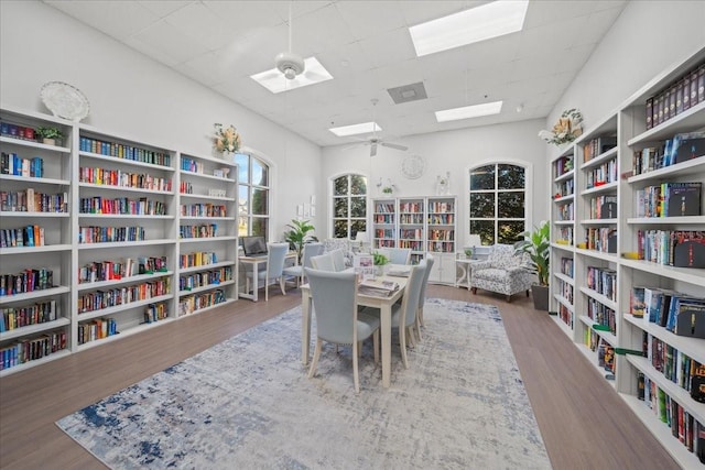 4254 Berwick Dr, Lake Wales, FL 33859 - dining room with wood finished floors, a skylight, a drop ceiling, and ceiling fan