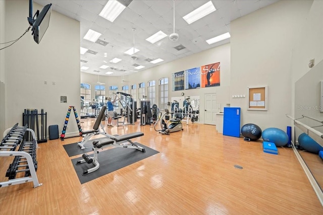 4254 Berwick Dr, Lake Wales, FL 33859 - gym with a towering ceiling, wood finished floors, and a paneled ceiling