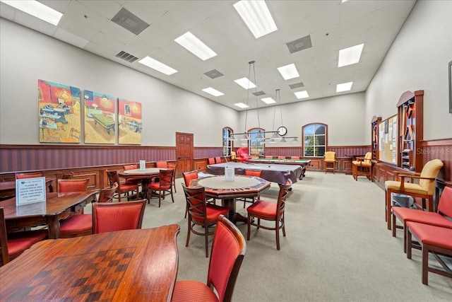 4254 Berwick Dr, Lake Wales, FL 33859 - dining space with wainscoting, carpet floors, a towering ceiling, and a paneled ceiling