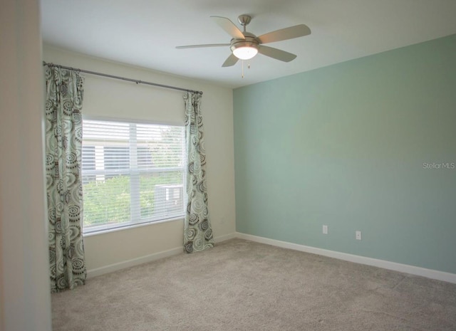 3023 Caneel, Winter Haven, FL 33884 - spare room featuring ceiling fan, carpet, and baseboards