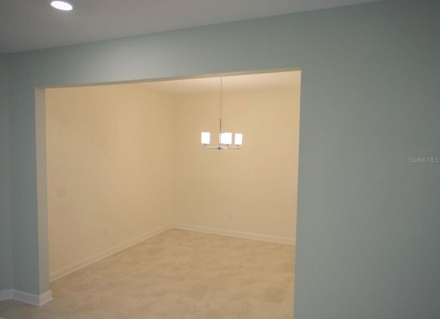 3023 Caneel, Winter Haven, FL 33884 - unfurnished room featuring recessed lighting, a chandelier, baseboards, and light carpet
