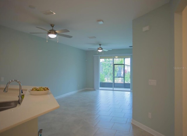 3023 Caneel, Winter Haven, FL 33884 - spare room with a sink, a ceiling fan, and baseboards