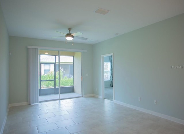 3023 Caneel, Winter Haven, FL 33884 - spare room featuring ceiling fan, baseboards, and light tile patterned flooring