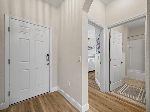 3802 Litchfield Loop, Lake Wales, FL 33859 - entrance foyer with arched walkways and light wood finished floors