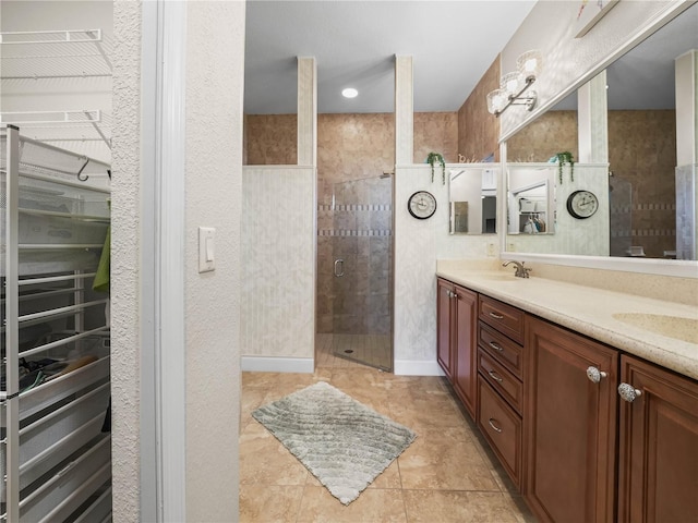 3802 Litchfield Loop, Lake Wales, FL 33859 - full bath with double vanity, a stall shower, and a spacious closet