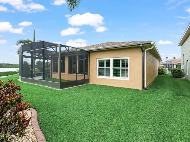 3802 Litchfield Loop, Lake Wales, FL 33859 - back of property featuring a yard and stucco siding