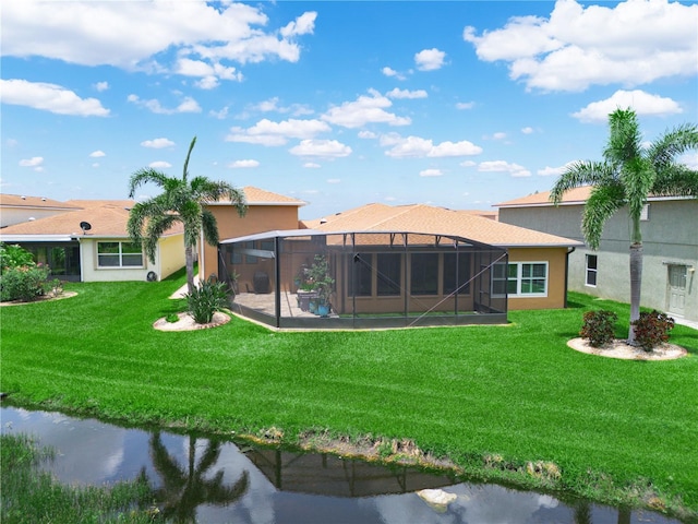 3802 Litchfield Loop, Lake Wales, FL 33859 - back of house featuring a lawn, glass enclosure, and stucco siding