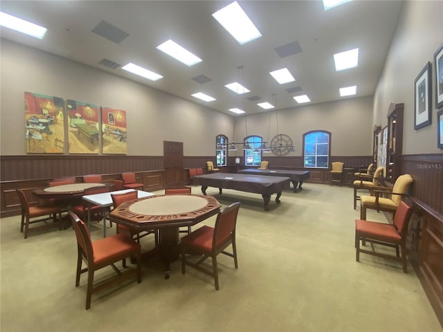 3802 Litchfield Loop, Lake Wales, FL 33859 - playroom with light colored carpet, wainscoting, pool table, high vaulted ceiling, and a decorative wall