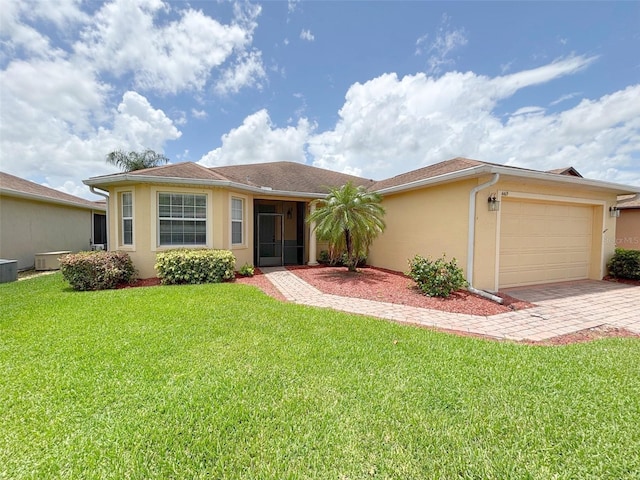 4469 Turnberry Ln, Lake Wales, FL 33859 - ranch-style house with stucco siding, a garage, driveway, and a front lawn