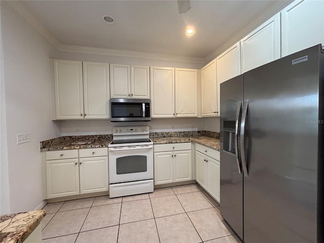 4469 Turnberry Ln, Lake Wales, FL 33859 - kitchen with refrigerator with ice dispenser, stainless steel microwave, white electric range, white cabinets, and crown molding