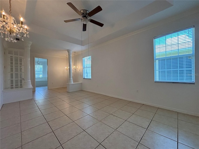 4469 Turnberry Ln, Lake Wales, FL 33859 - spare room with decorative columns, light tile patterned flooring, a chandelier, ceiling fan, and crown molding