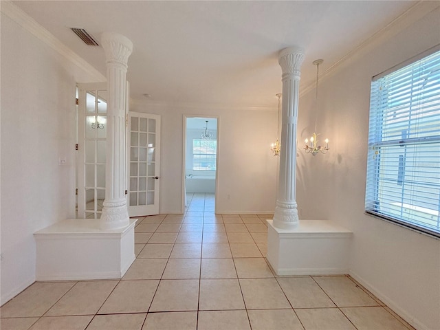 4469 Turnberry Ln, Lake Wales, FL 33859 - spare room featuring ornamental molding, light tile patterned floors, decorative columns, and a chandelier