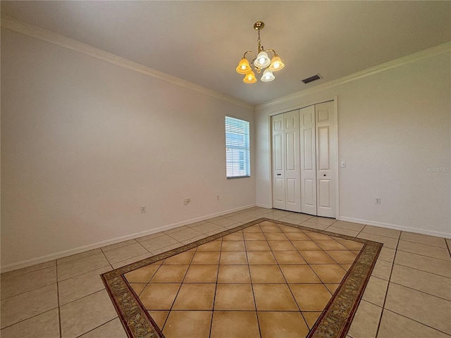4469 Turnberry Ln, Lake Wales, FL 33859 - unfurnished bedroom with light tile patterned flooring, a chandelier, crown molding, and a closet