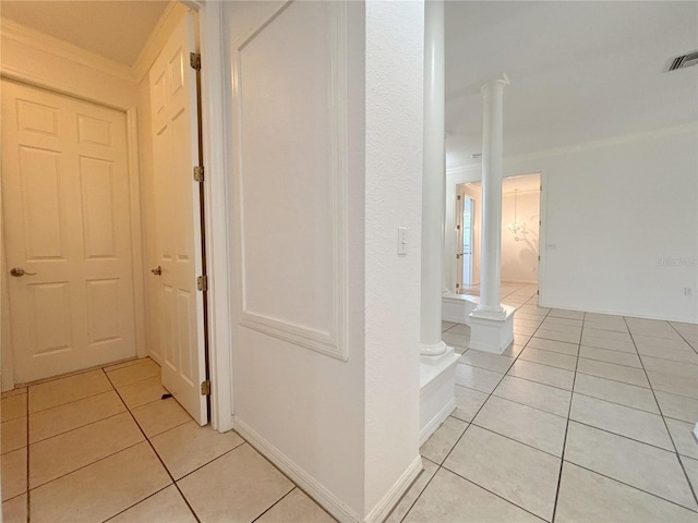 4469 Turnberry Ln, Lake Wales, FL 33859 - corridor with light tile patterned floors and decorative columns