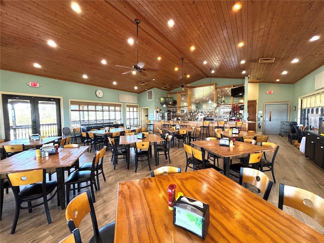 4469 Turnberry Ln, Lake Wales, FL 33859 - dining area featuring lofted ceiling, light wood-style flooring, ceiling fan, wood ceiling, and french doors