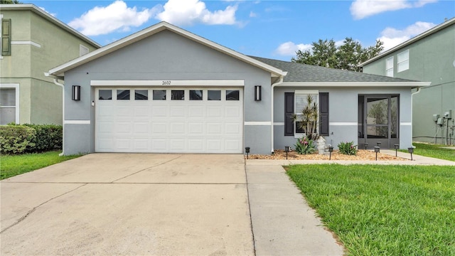 2602 Whitewood Rd, Mulberry, FL 33860 - view of front of house with an attached garage, stucco siding, driveway, a front lawn, and a shingled roof