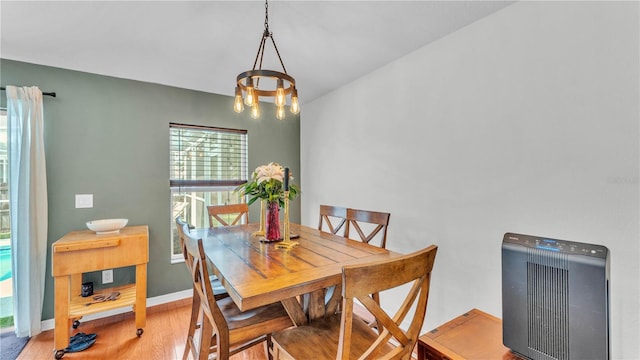 2602 Whitewood Rd, Mulberry, FL 33860 - dining space featuring wood finished floors and a chandelier