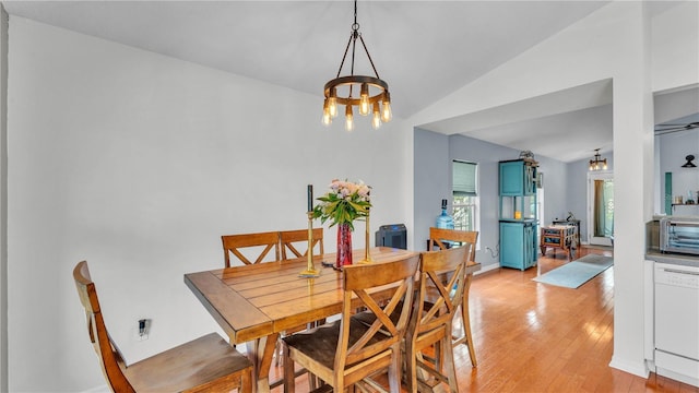 2602 Whitewood Rd, Mulberry, FL 33860 - dining space with a chandelier, light wood-type flooring, and vaulted ceiling