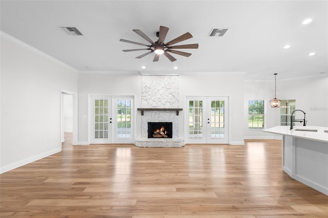 5820 E Johnson Ave, Haines City, FL 33844 - unfurnished living room featuring ceiling fan, crown molding, plenty of natural light, french doors, and recessed lighting