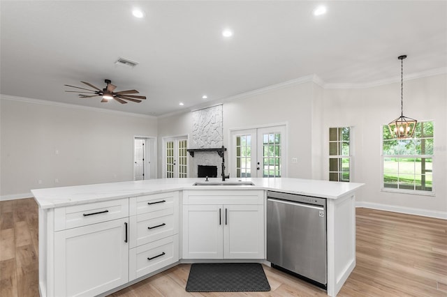 5820 E Johnson Ave, Haines City, FL 33844 - kitchen with dishwasher, open floor plan, french doors, crown molding, and white cabinets