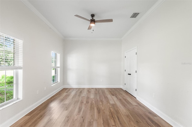 5820 E Johnson Ave, Haines City, FL 33844 - empty room with healthy amount of natural light, crown molding, light wood finished floors, and ceiling fan