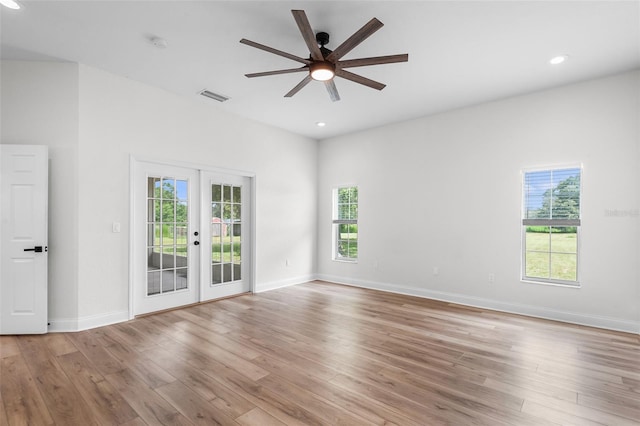 5820 E Johnson Ave, Haines City, FL 33844 - empty room featuring french doors, ceiling fan, healthy amount of natural light, light wood finished floors, and recessed lighting