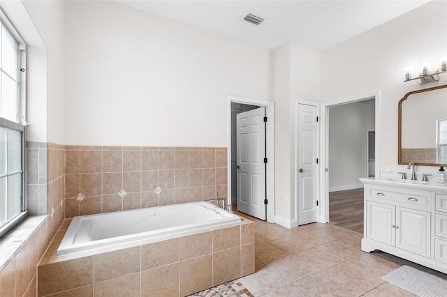 5820 E Johnson Ave, Haines City, FL 33844 - bathroom with vanity, a bath, and tile patterned flooring
