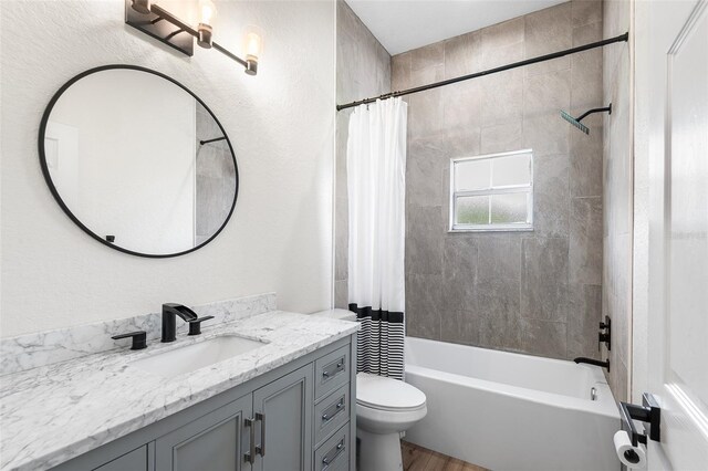 5820 E Johnson Ave, Haines City, FL 33844 - full bath with vanity, shower / bathtub combination with curtain, and wood finished floors