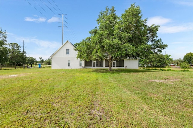 5820 E Johnson Ave, Haines City, FL 33844 - rear view of property with a lawn