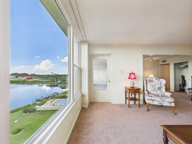 700 Mirror Ter NW Unit 702, Winter Haven, FL 33881 - sunroom / solarium featuring a water view and plenty of natural light