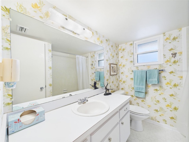 700 Mirror Ter NW Unit 702, Winter Haven, FL 33881 - full bathroom featuring vanity, wallpapered walls, tile patterned flooring, and curtained shower