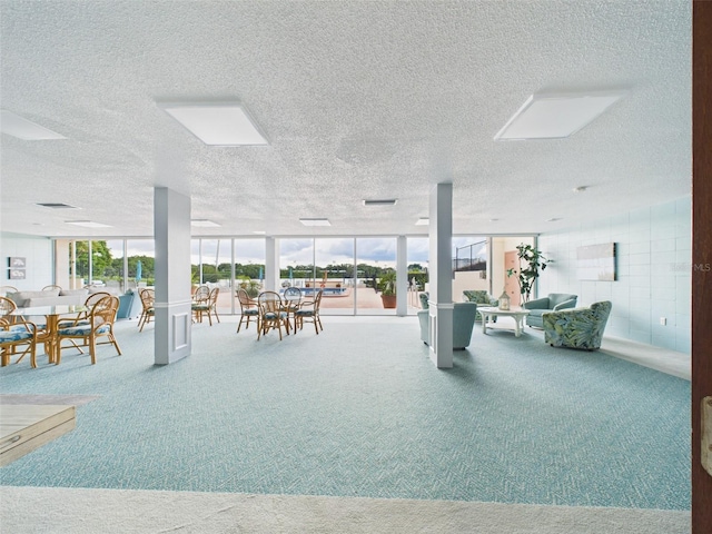 700 Mirror Ter NW Unit 702, Winter Haven, FL 33881 - interior space with a textured ceiling and outdoor dining area