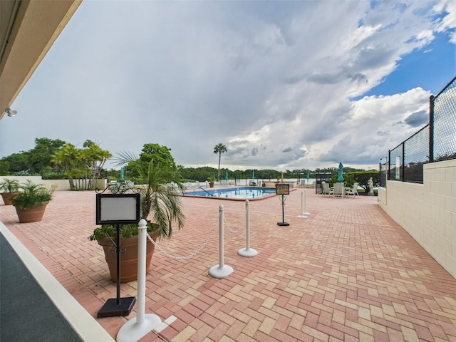 700 Mirror Ter NW Unit 702, Winter Haven, FL 33881 - view of property's community with a pool and a patio