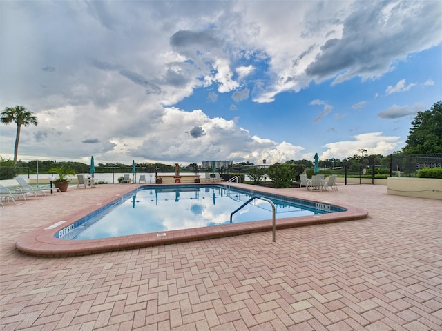 700 Mirror Ter NW Unit 702, Winter Haven, FL 33881 - community pool featuring a patio