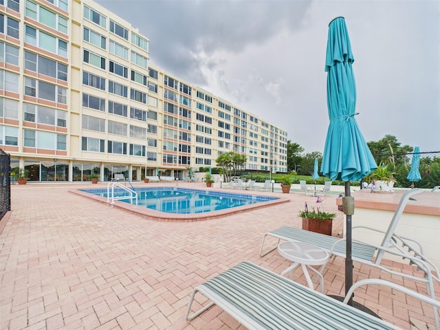 700 Mirror Ter NW Unit 702, Winter Haven, FL 33881 - community pool with a patio