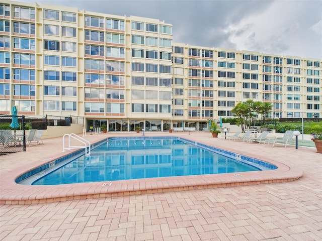 700 Mirror Ter NW Unit 702, Winter Haven, FL 33881 - community pool featuring a patio area