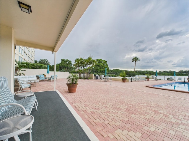700 Mirror Ter NW Unit 702, Winter Haven, FL 33881 - view of patio featuring a community pool