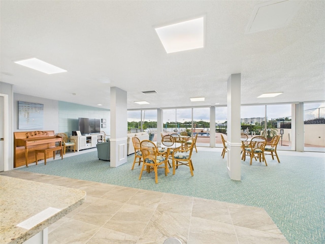 700 Mirror Ter NW Unit 702, Winter Haven, FL 33881 - dining area with plenty of natural light and floor to ceiling windows