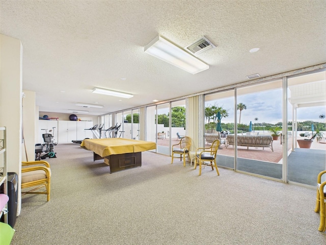 700 Mirror Ter NW Unit 702, Winter Haven, FL 33881 - game room featuring billiards, carpet flooring, a textured ceiling, and expansive windows