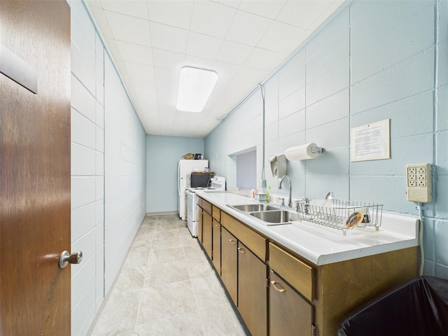 700 Mirror Ter NW Unit 702, Winter Haven, FL 33881 - bathroom with vanity, washing machine and dryer, marble finish floors, and tile walls