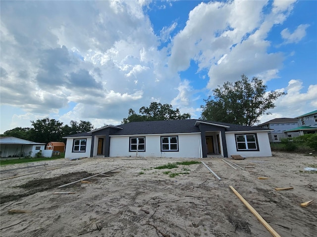 602 Lime Ave, Dundee, FL 33838 - view of front of house with uncovered parking and stucco siding