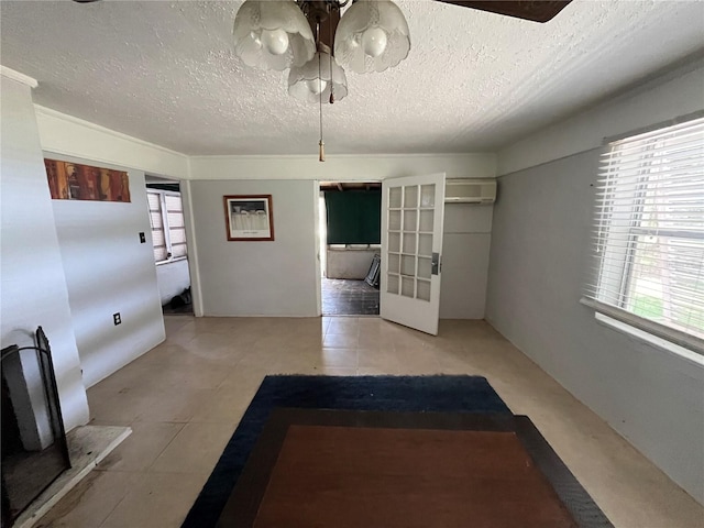 1805 S Lake Reedy Blvd, Frostproof, FL 33843 - hall with plenty of natural light, a textured ceiling, tile patterned flooring, and french doors
