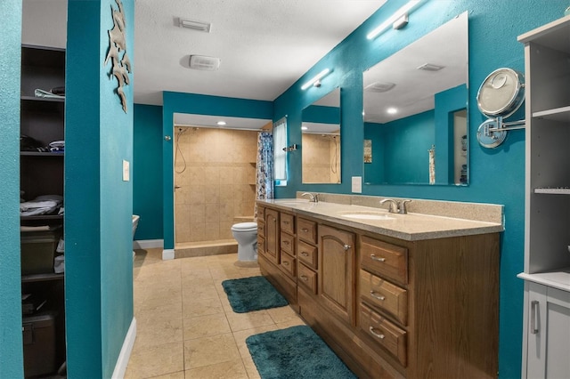 704 Butternut Pl, Lakeland, FL 33813 - full bath with double vanity, a tile shower, and tile patterned floors