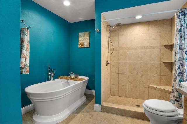 704 Butternut Pl, Lakeland, FL 33813 - bathroom with tiled shower, a freestanding tub, and tile patterned flooring